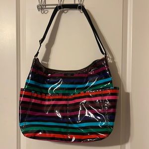 Kate Spade rainbow striped purse. PVC material.